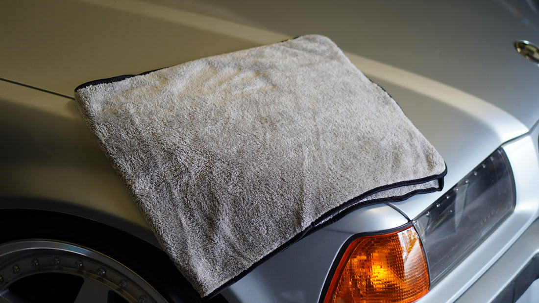 Lux drying towel placed on bonnet of bmw e36 compact